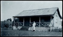 Father Victorinus Claesen, SS.CC., in front of the rectory of Saint Sylvester Church, Kilauea, Kauai.